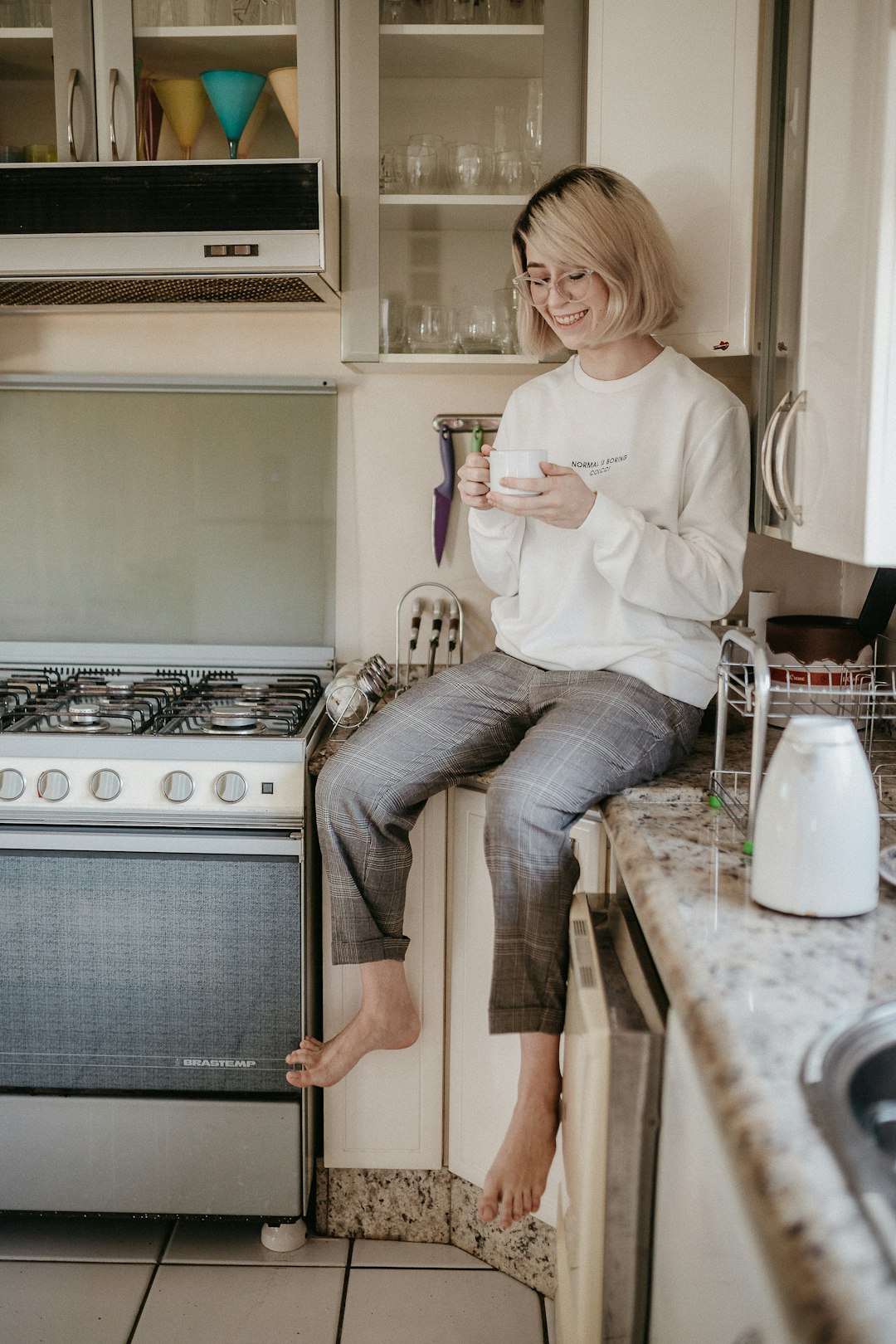 Two mugs of tea on a kitchen table during a conversation